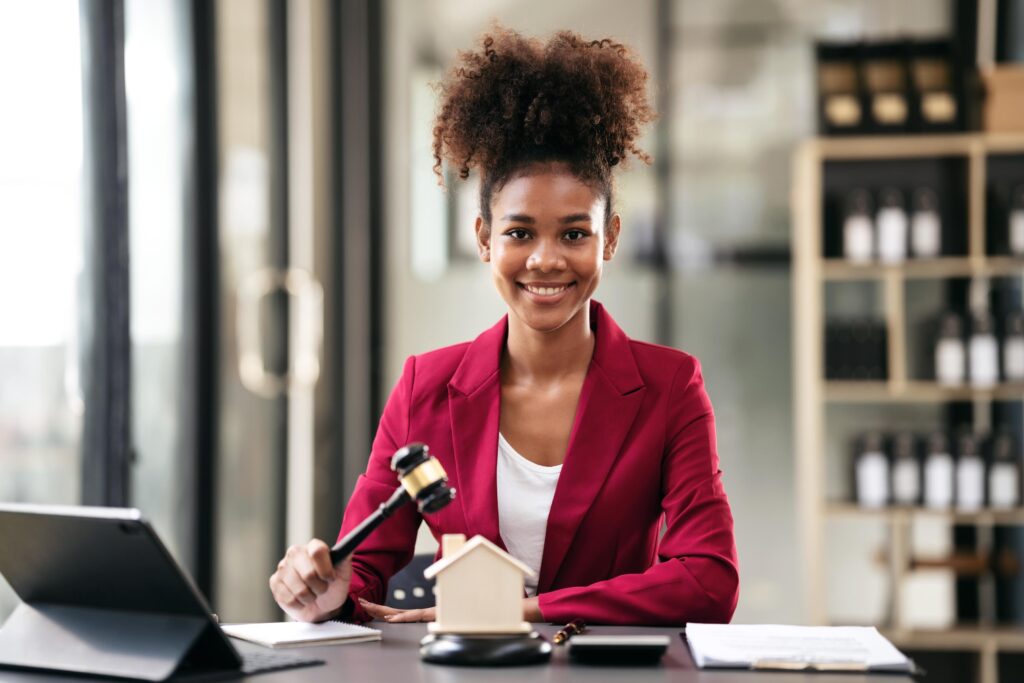 African american lawyer woman in suit holding judge hammer with