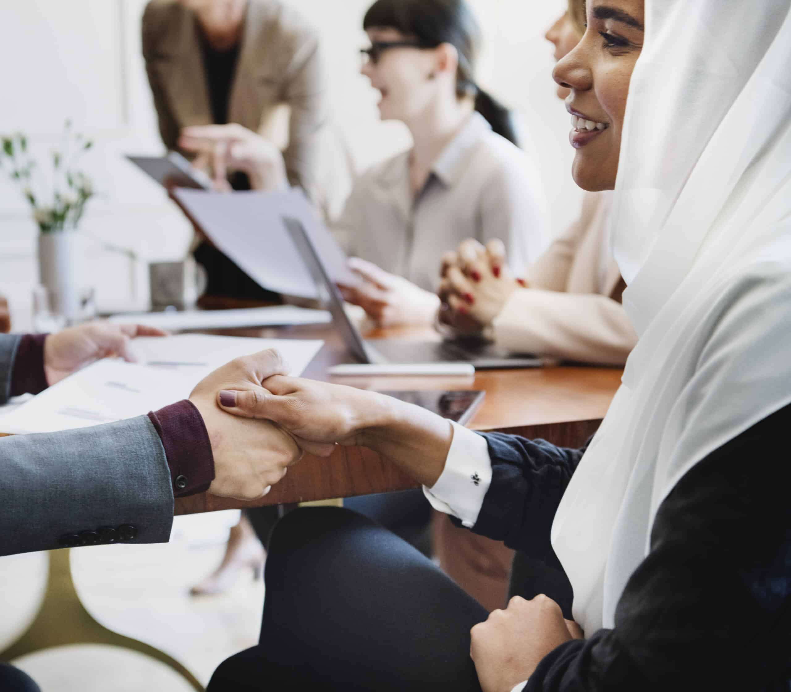 Meeting with Handshake at Corporate Workplace