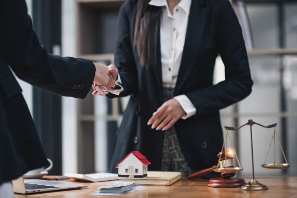 Handshake of cooperation customer and saleswoman after agreement, successful car loan contract buying or selling new vehicle.