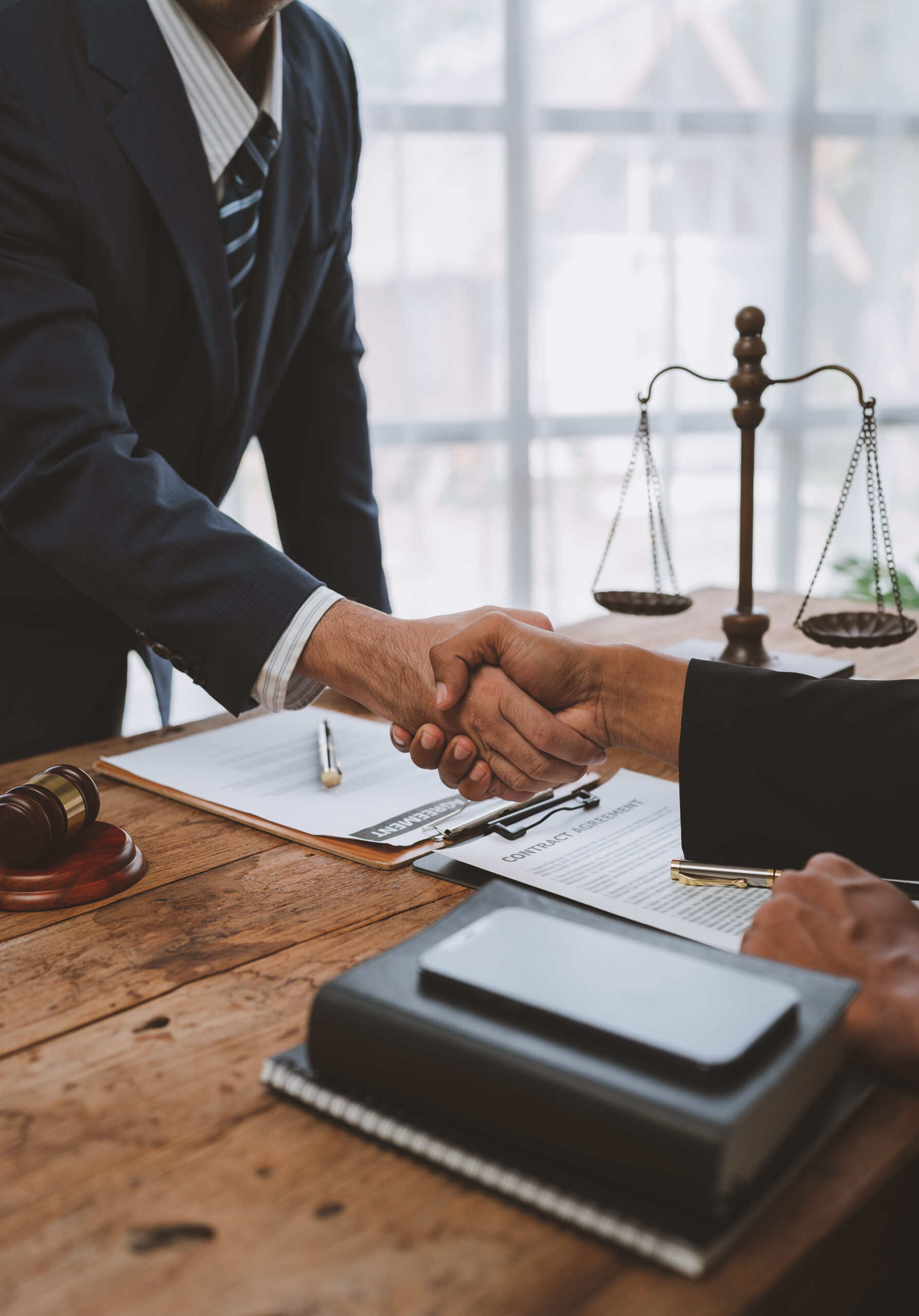 Lawyers join hands with business people to sign a partnership ag
