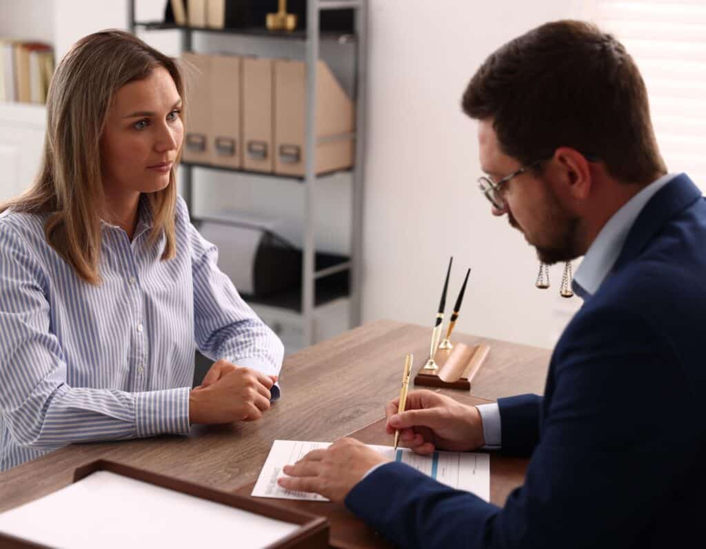 Serious Woman Consulting With a Professional Man in a Modern Office