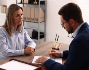 Serious Woman Consulting With a Professional Man in a Modern Office