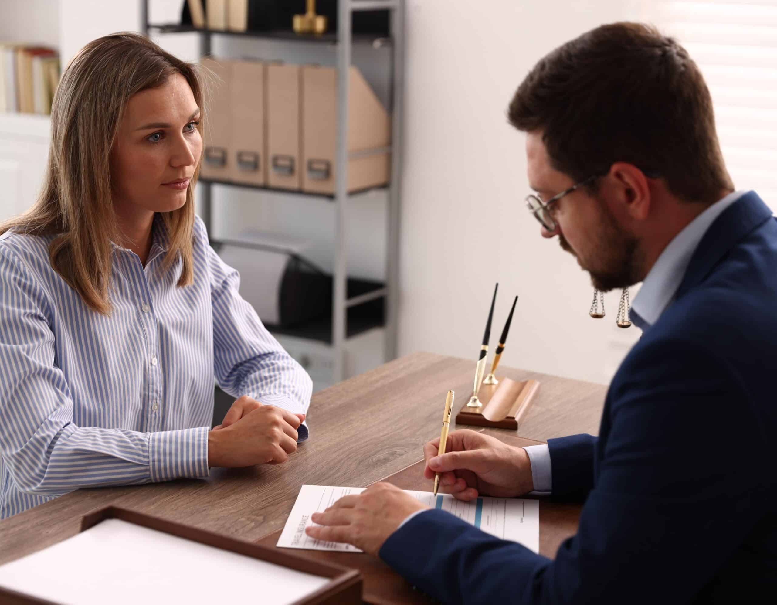 Serious Woman Consulting With a Professional Man in a Modern Office