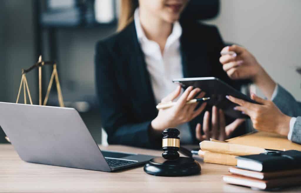 Online Law Service on Laptop with Legal Statue
