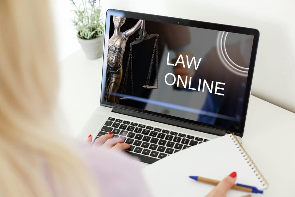 online law service on laptop with legal statue 2026 09 22 08 04 14 utc